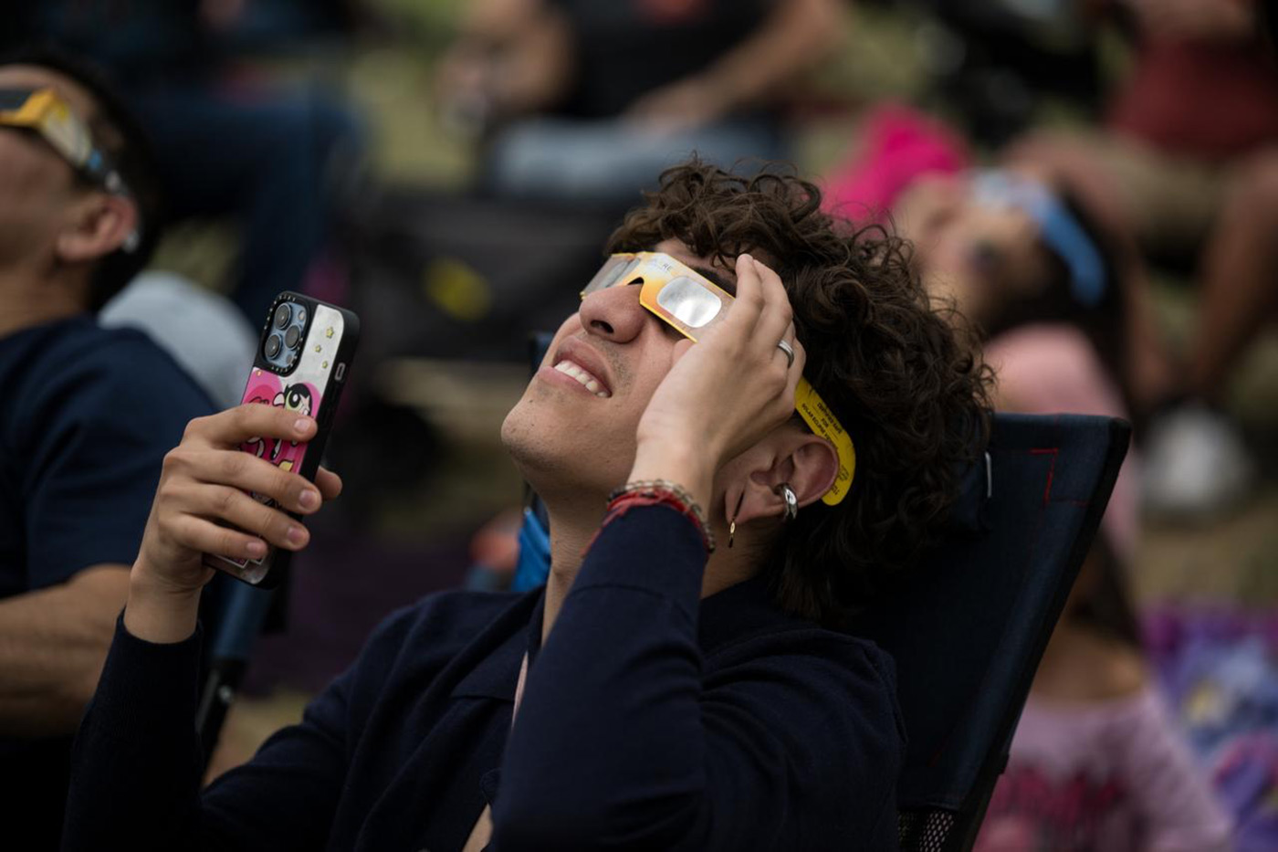 watch a total solar eclipse through protective glasses