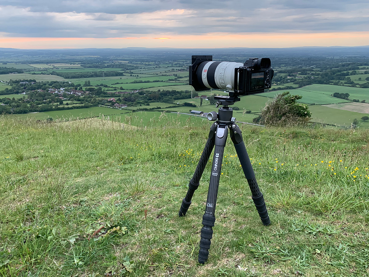 Using the tripod in the field on a windy sunset
