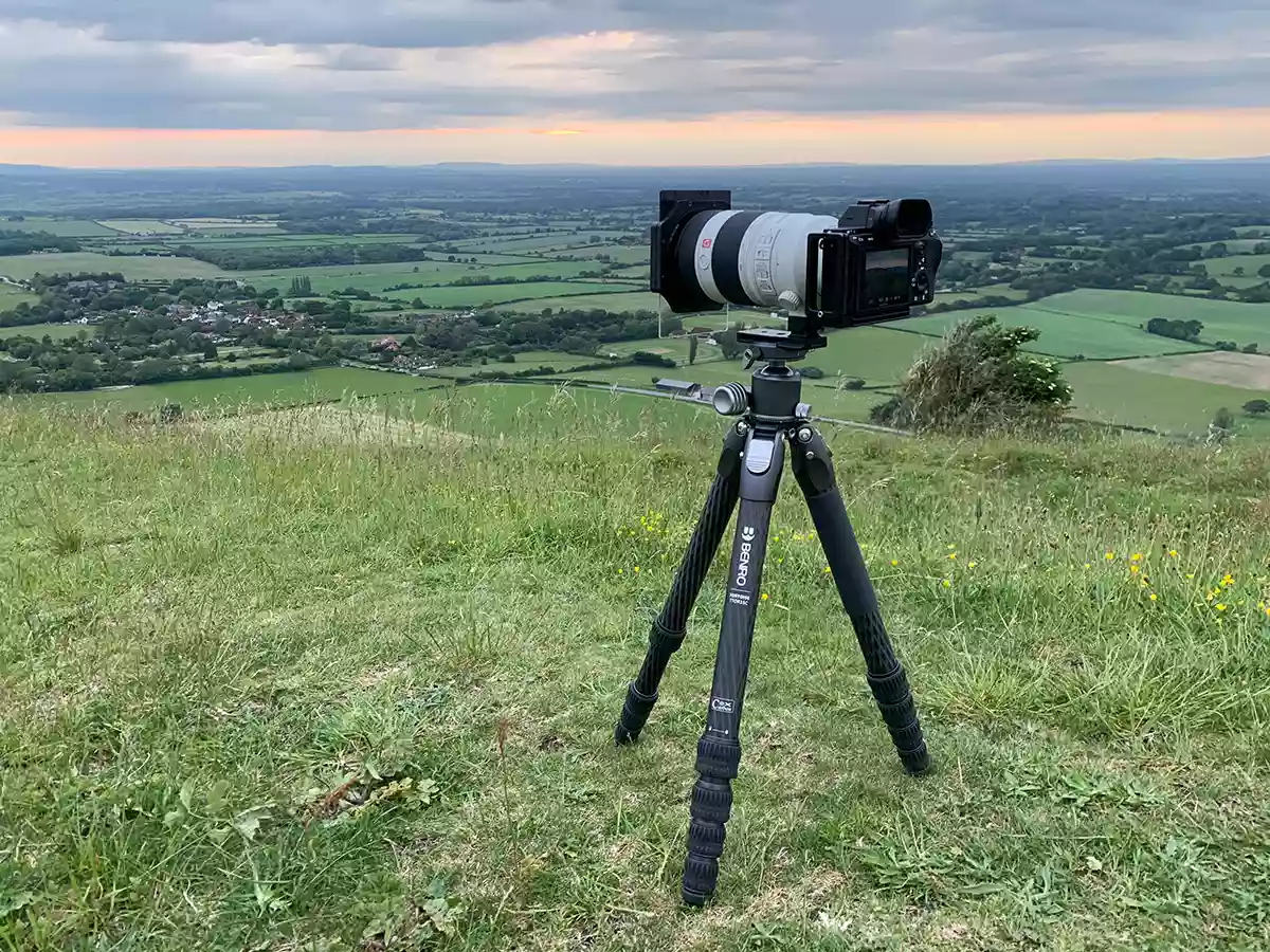 Using the tripod in the field on a windy sunset