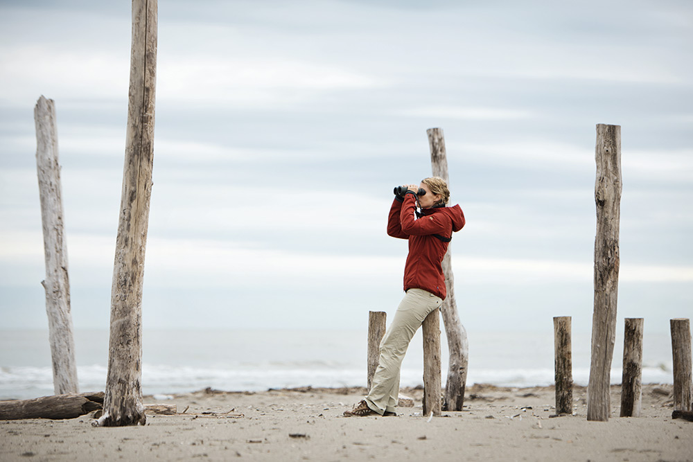 Using the latest binocular on the beach for observation