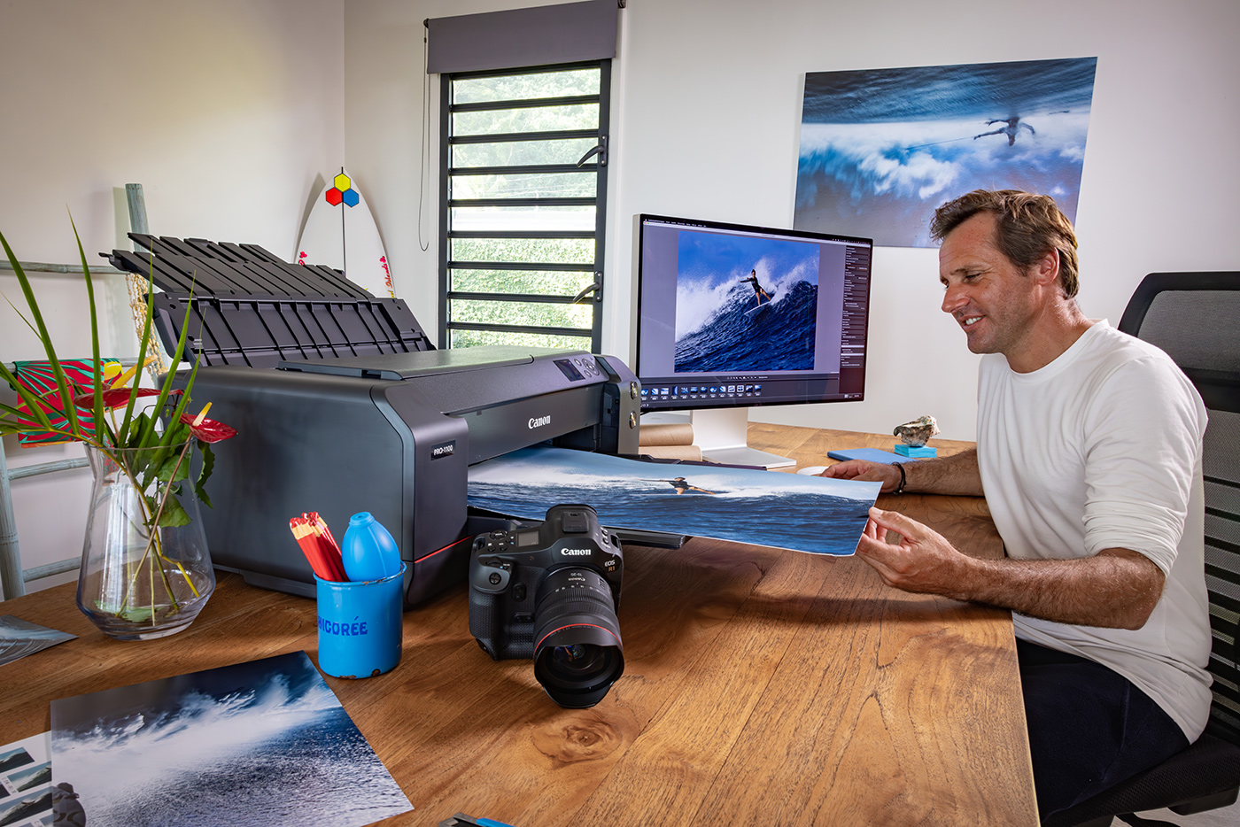 Admiring a large format A2 print of surfing from the Canon PRO-1100