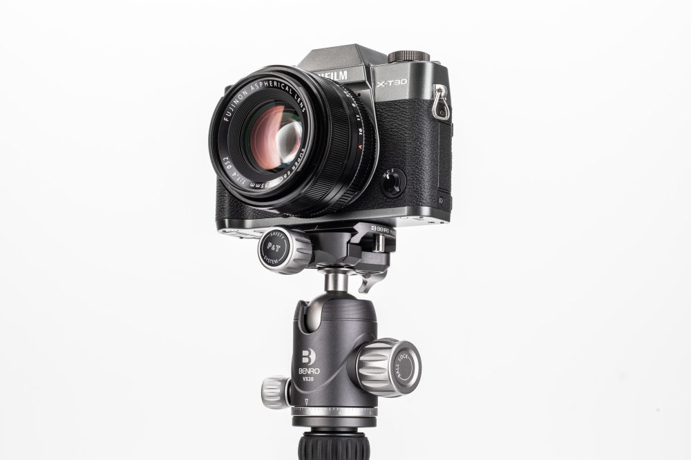 Fujifilm camera and lens mounted on compact benro tripod