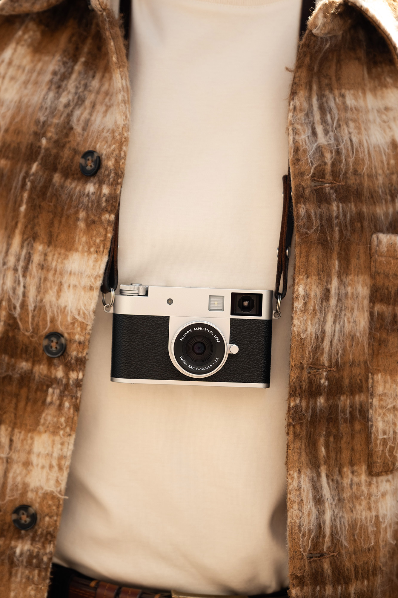 Camera hanging on photographer's chest