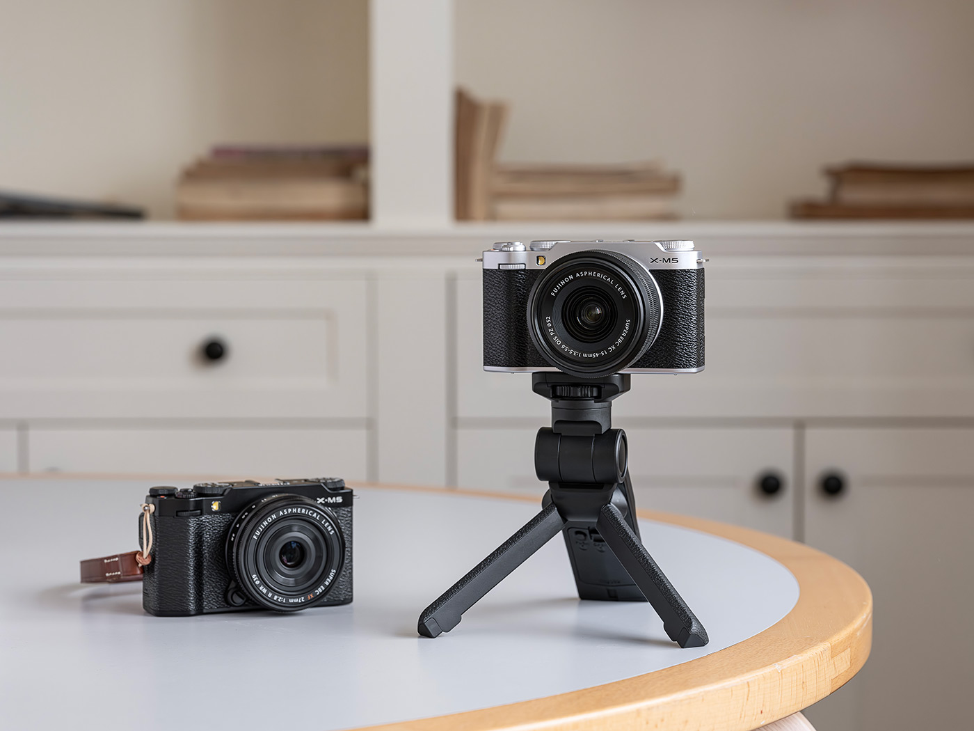 B lack and silver versions of the camera with vlogging grip