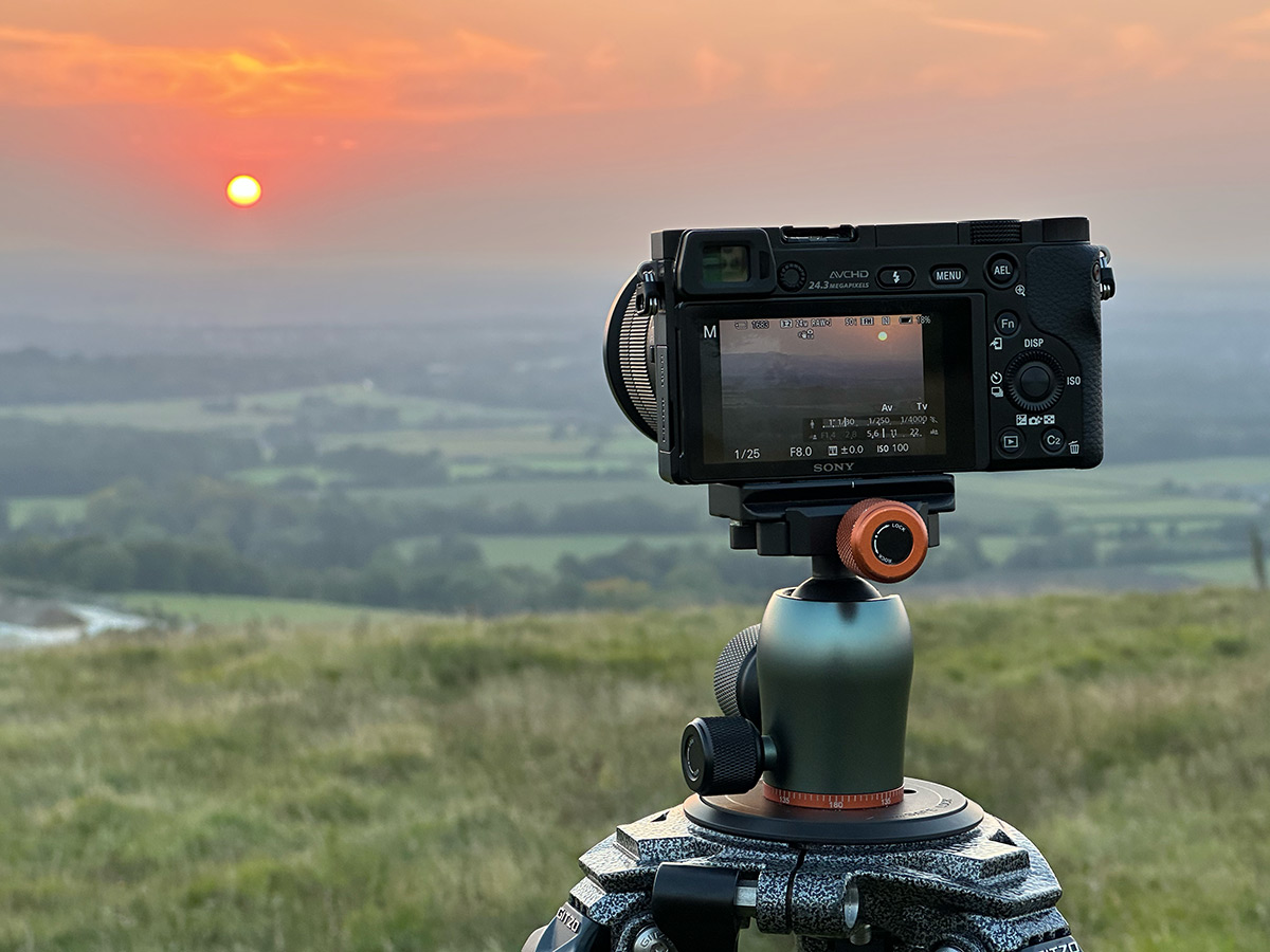 Camera mounted on tripod for sunset shot