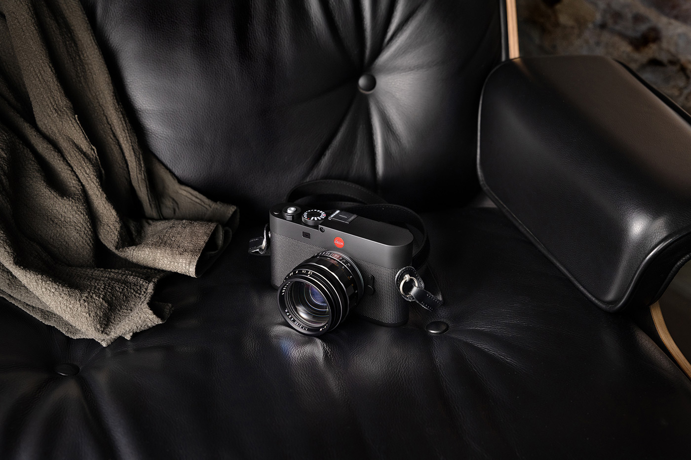 Lifestyle Leica M EV1 camera on sofa