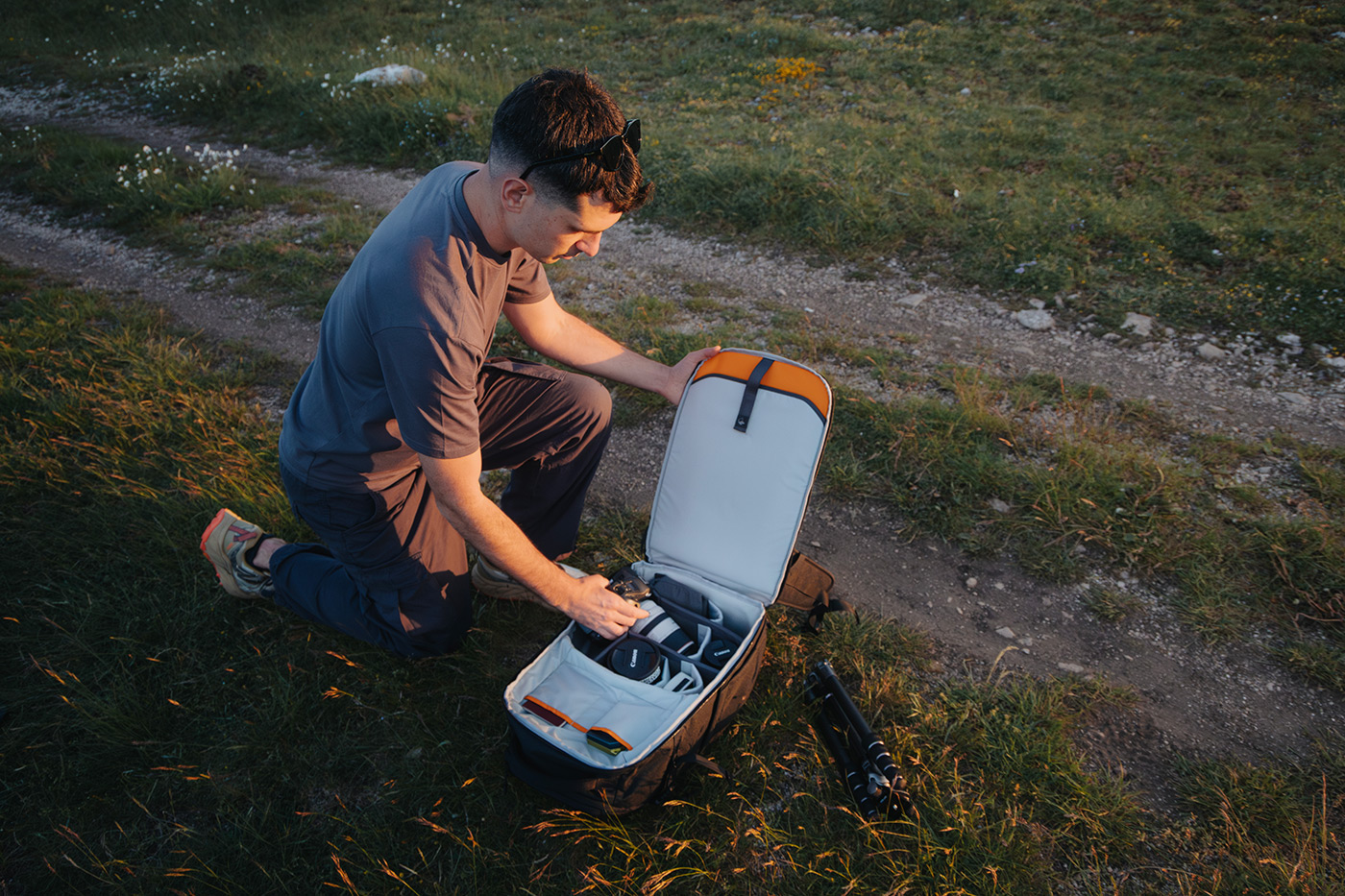Photographer grabbing equipment from the large rear opening