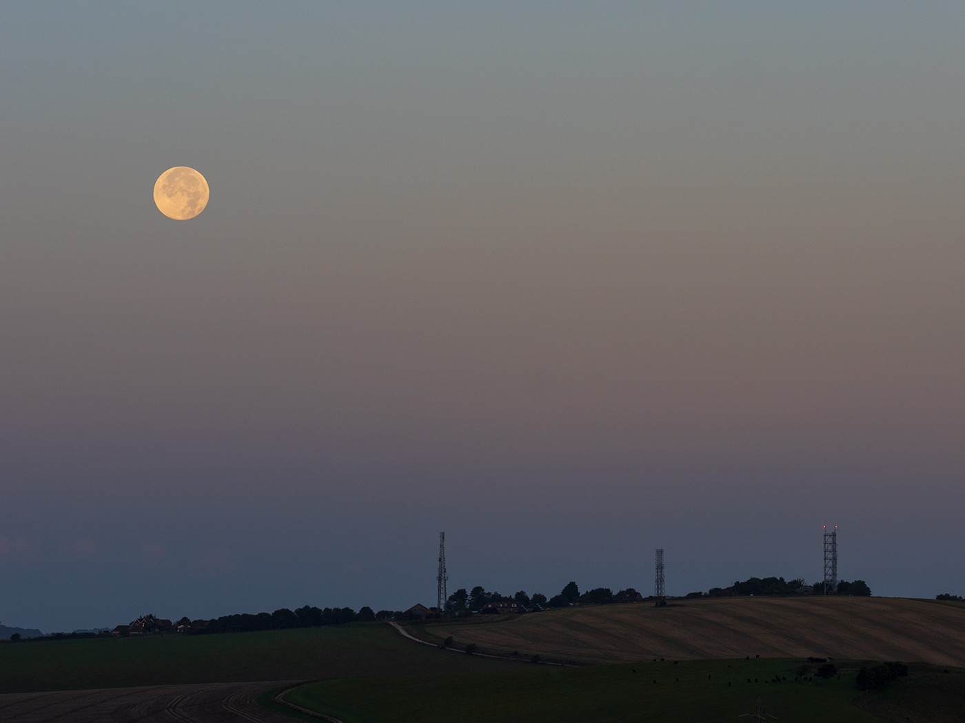 Capturing a full moon within a landscape September 2025 by Nick Dautlich. Shot on OM 1 Mark II with OM System M.Zuiko Digital ED 40-150mm F/2.8 PRO lens at 100mm. Camera settings: 1/160 sec. f/8. ISO 200.