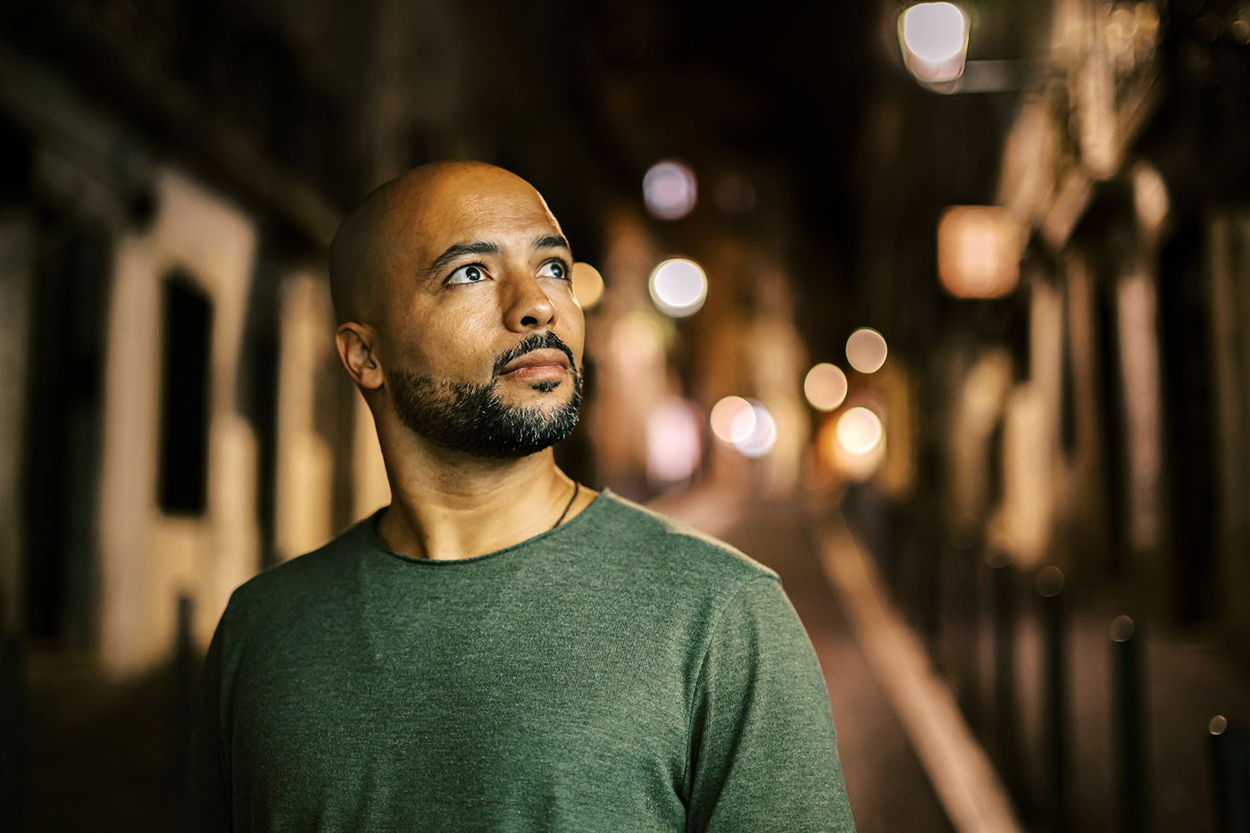 Sample image of man at night with bokeh rendition