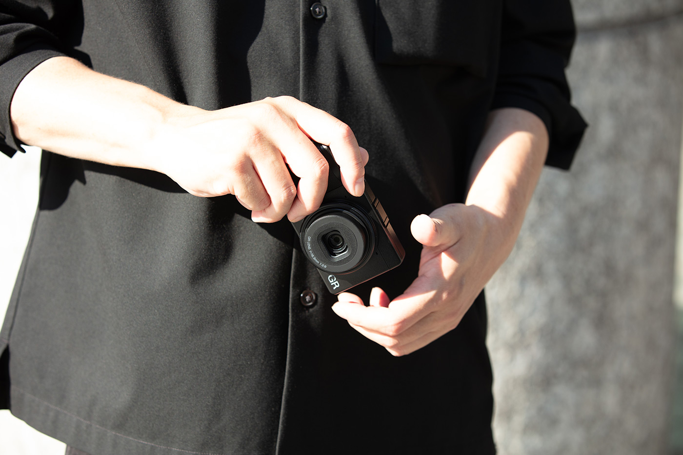 The compact camera in hand