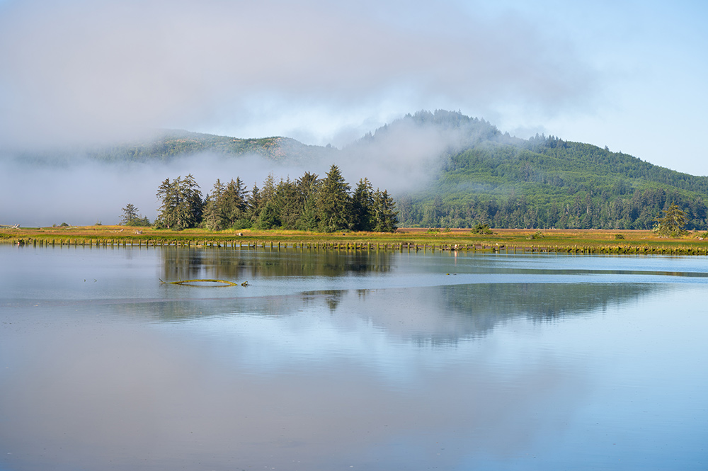 Sample landscape photo with lake and island in mist using Sigma 28-105mm DG DN Art Lens