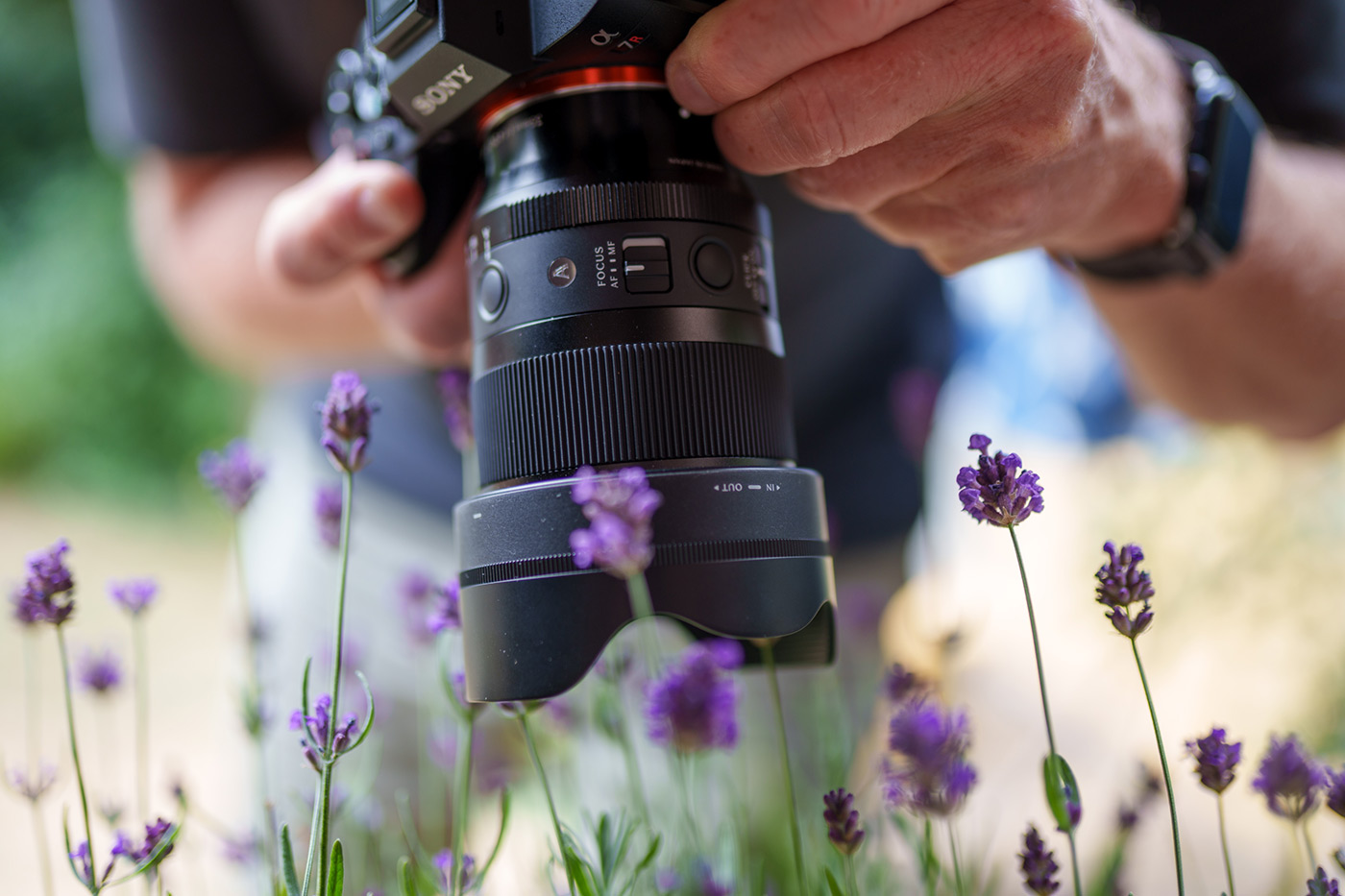 The lens in hand capturing close-up shots