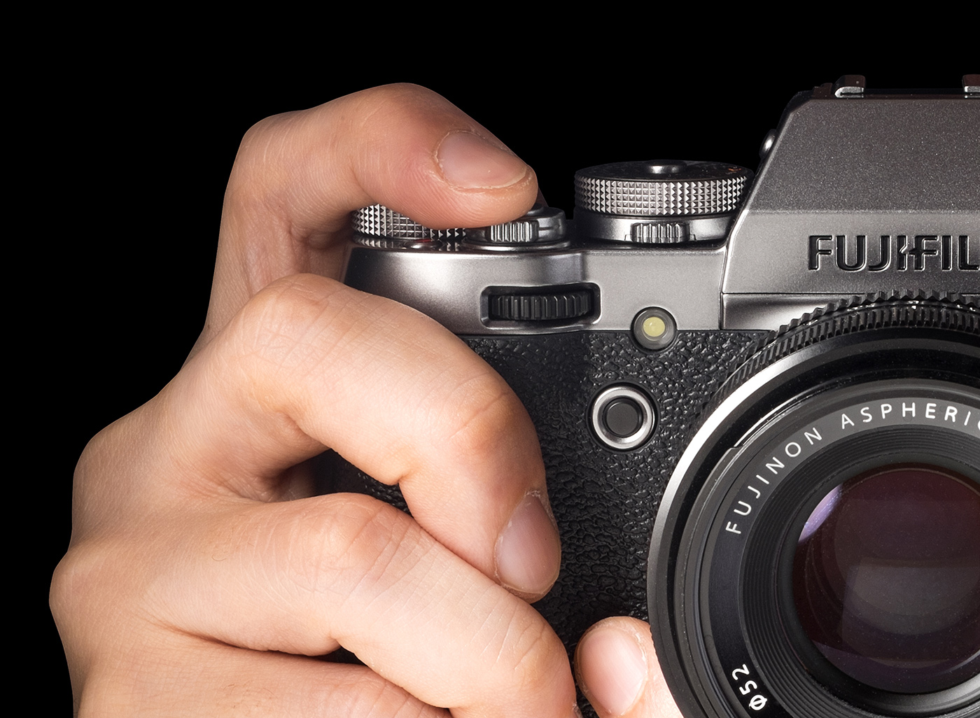 Close-up of a Fujifilm X camera in the hand