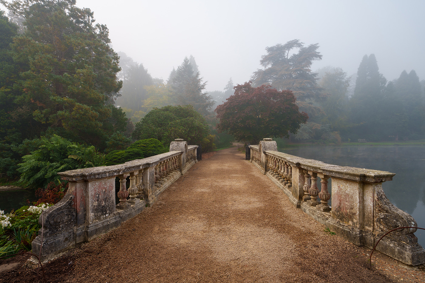 Sample 06 Stone Bridge Leading into a Misty Autumn Landscape at 16mm. Camera settings: 1/250 sec. f/5.6. ISO 125.