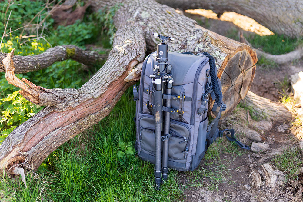Tripod mounted to camera backpack
