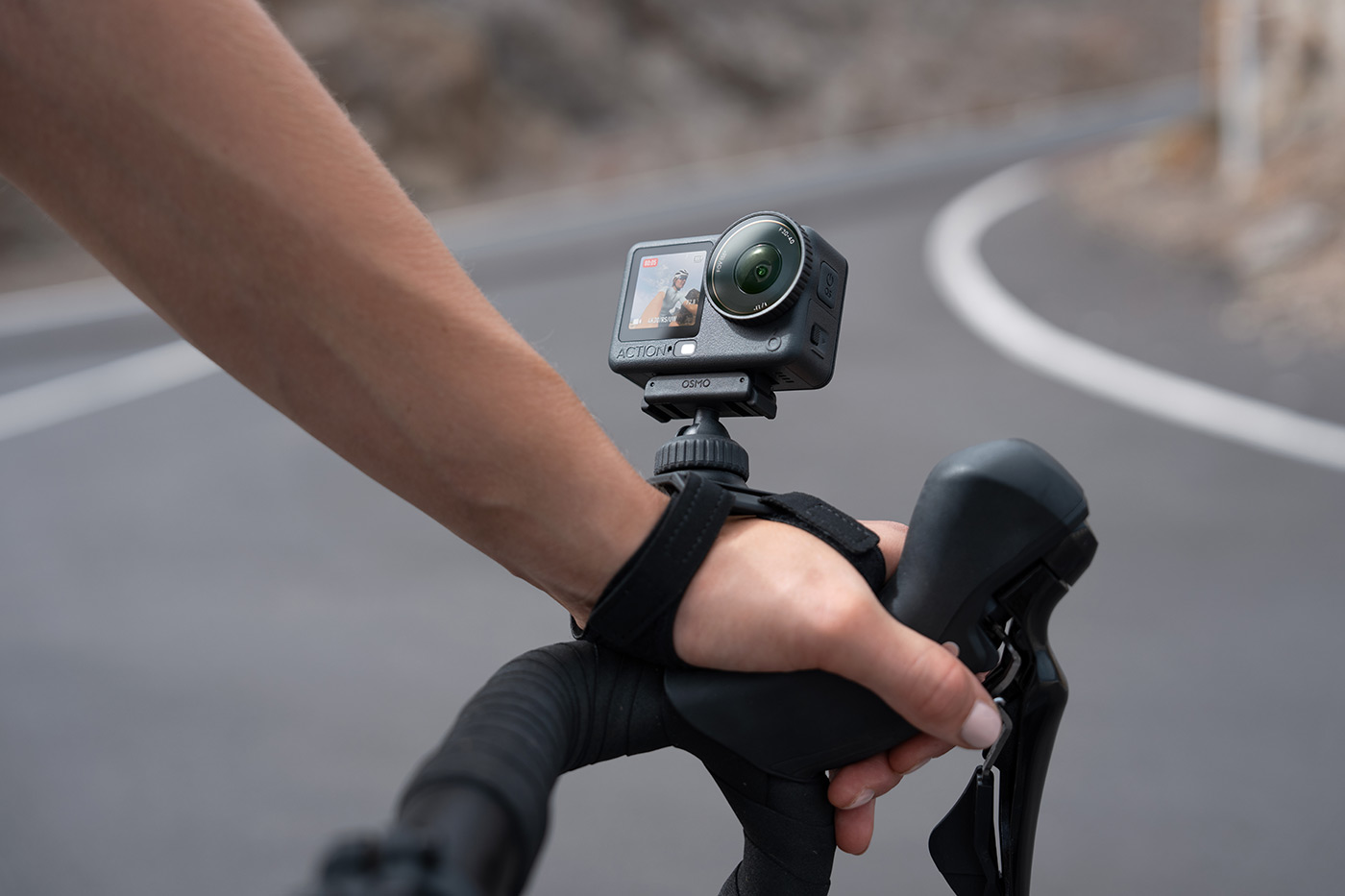 road cycling with the DJI Osmo Action 6 mounted on wrist