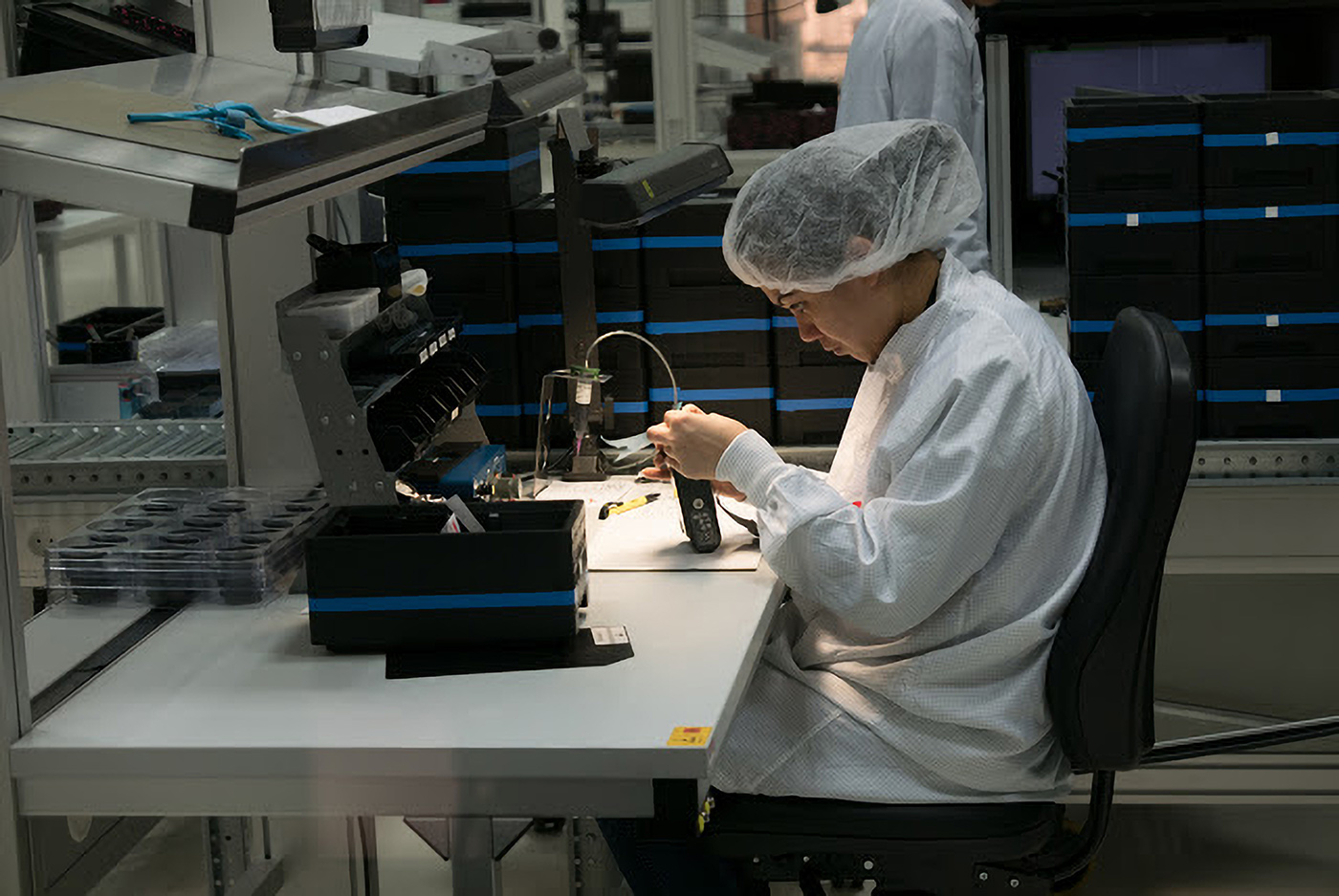 Third image of the factory, with a worker concentrating