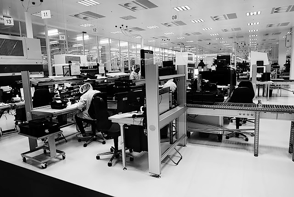 B&W image of the Leica factory with a sterile clean environment